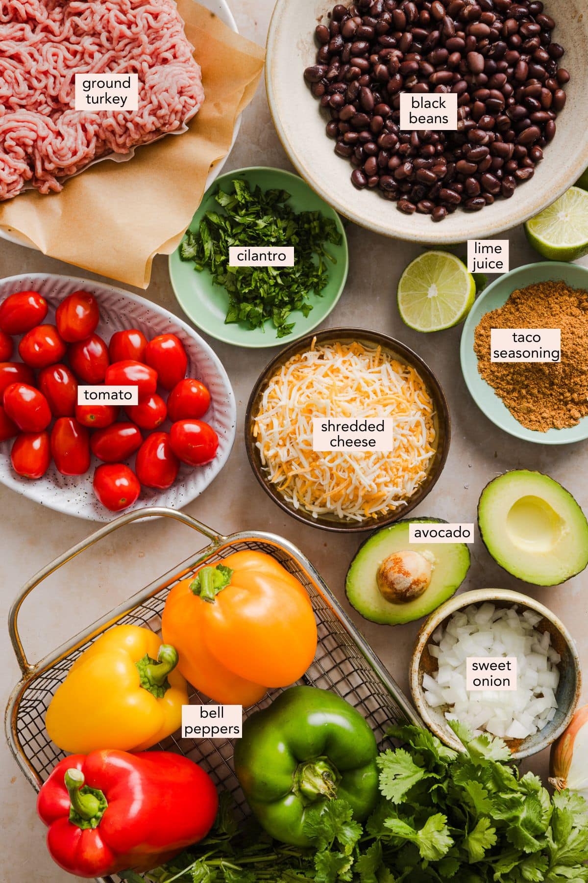 Bell pepper nachos made with nutritious ingredients like bell peppers, lean meat and beans and topped with your favorite nacho toppings. Ingredients for bell pepper nachos on a countertop with labels.