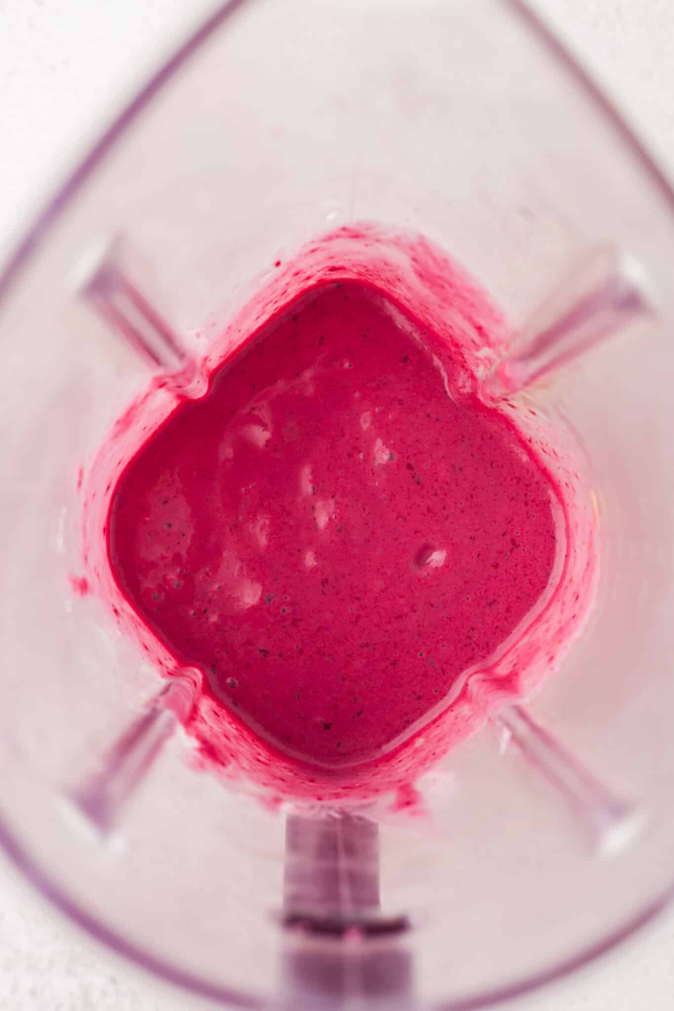 Blackberry smoothie blended in a blender.