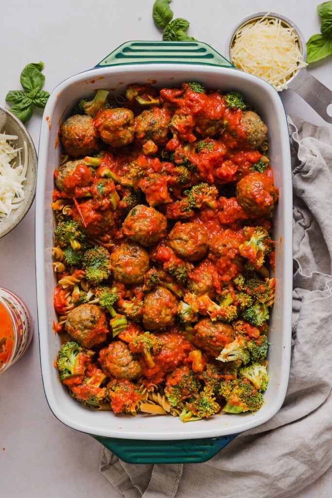 This dump and bake meatball casserole is easy, family-friendly and super simple. Throw your ingredients in a dish, and bake! Ingredients for dump and bake meatball casserole in a baking dish ready for the oven.