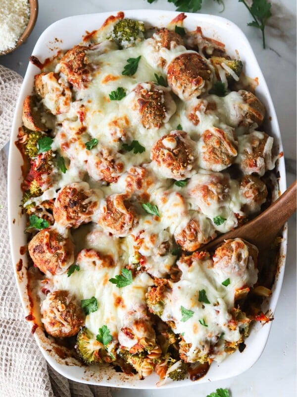 Dump and bake meatball casserole baked in a casserole dish and garnished with parsley.