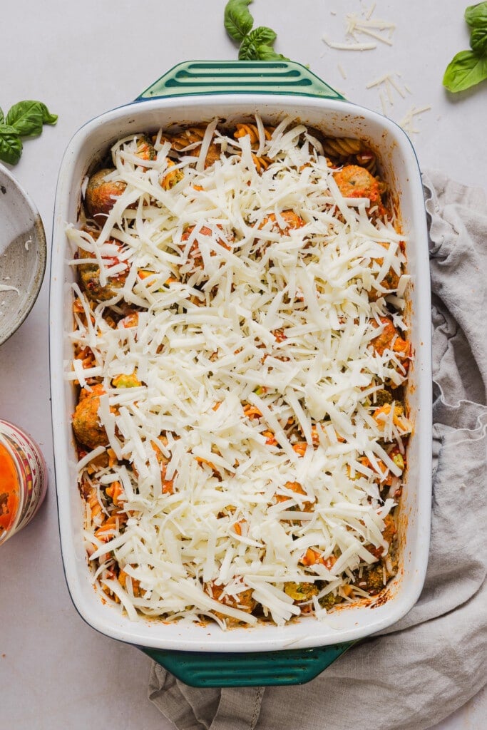 This dump and bake meatball casserole is easy, family-friendly and super simple. Throw your ingredients in a dish, and bake! Dump and bake meatball casserole topped with mozzarella cheese.
