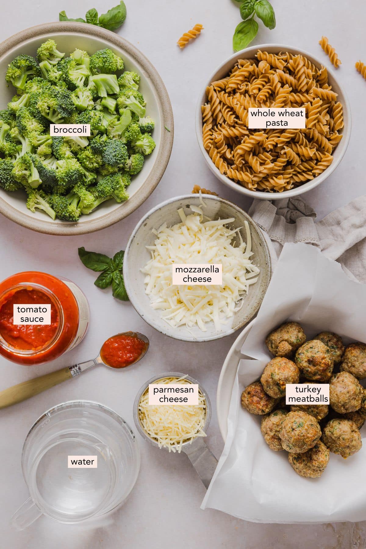 This dump and bake meatball casserole is easy, family-friendly and super simple. Throw your ingredients in a dish, and bake! Ingredients for dump and bake meatball casserole on a countertop with labels.