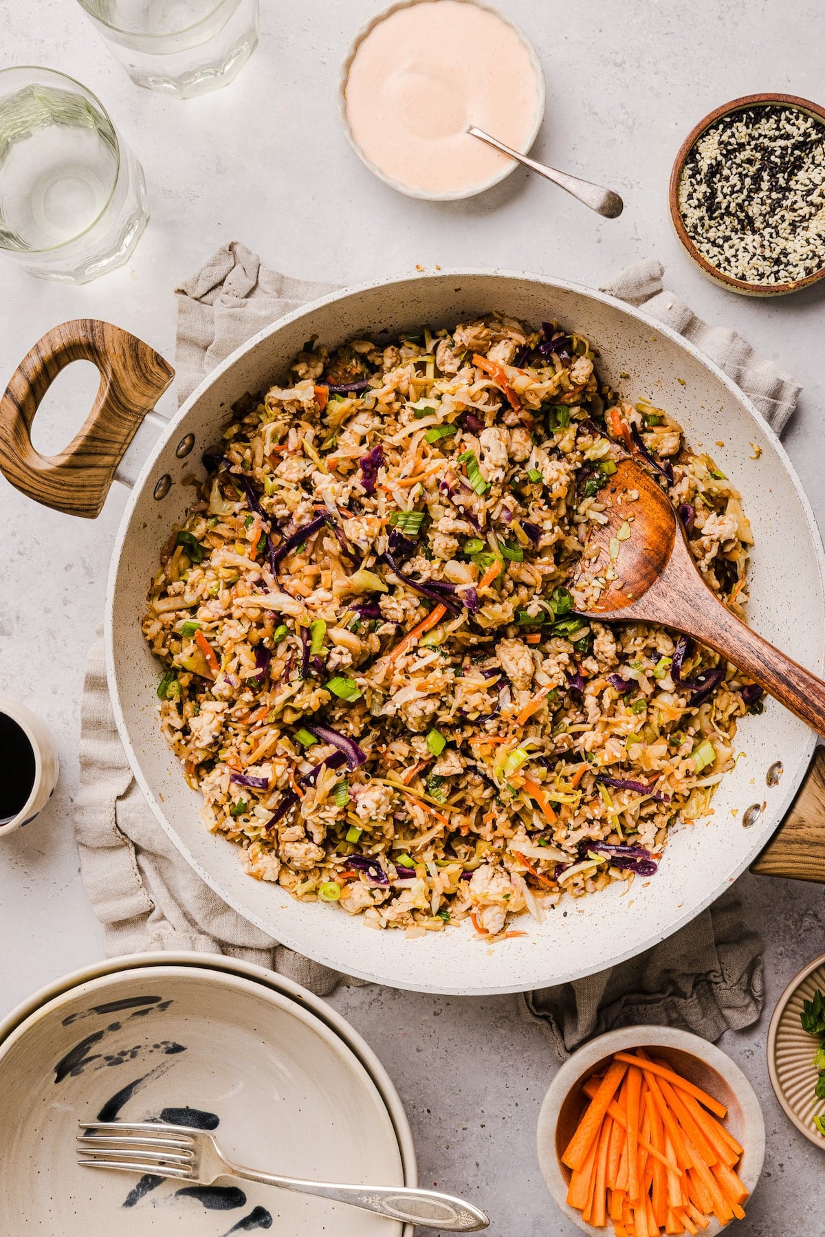 Inside out egg roll bowl being sautéed in a pan.