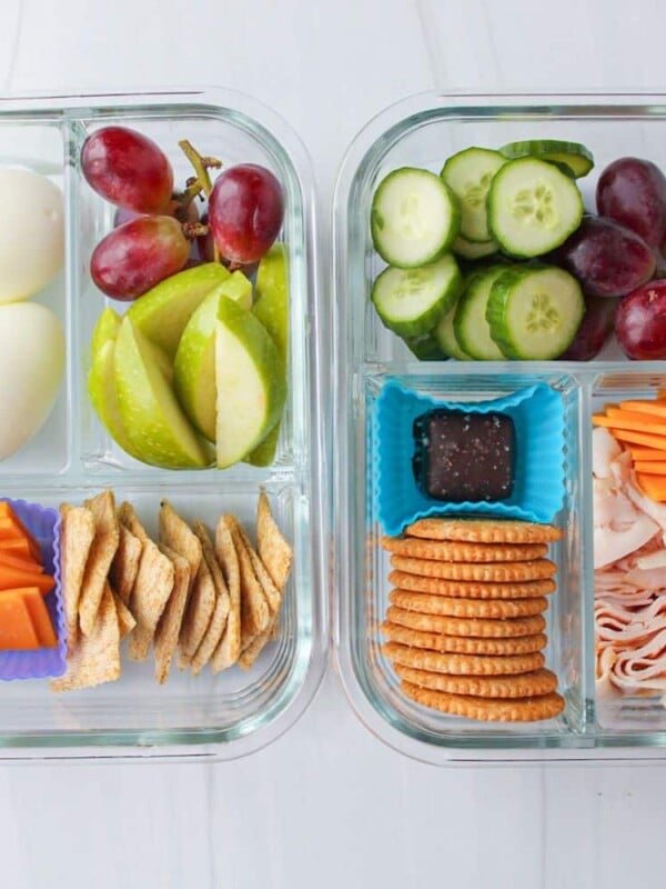 Adult lunchables in glass containers on a countertop.