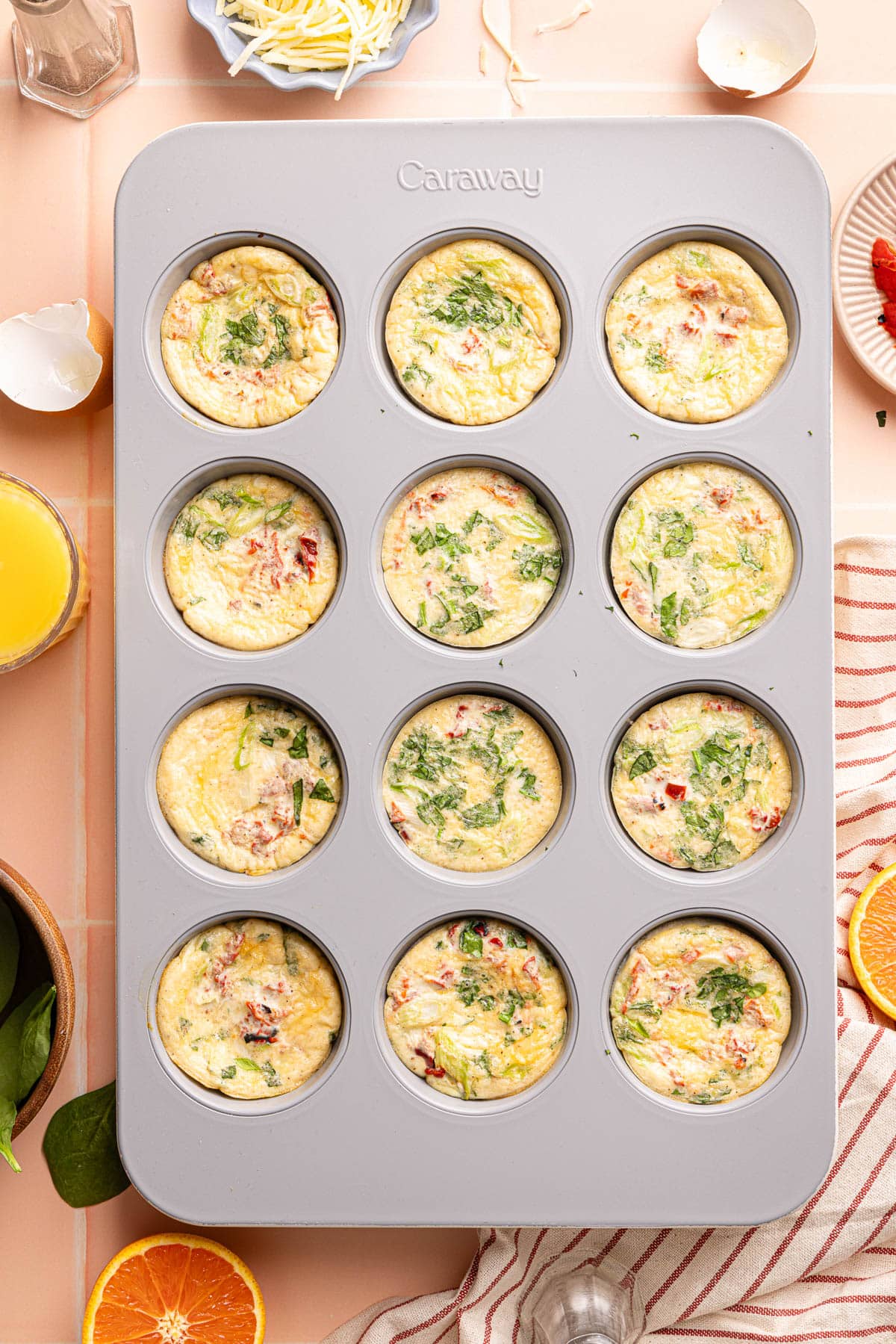 The egg bites in the muffin pan on a countertop after baking.