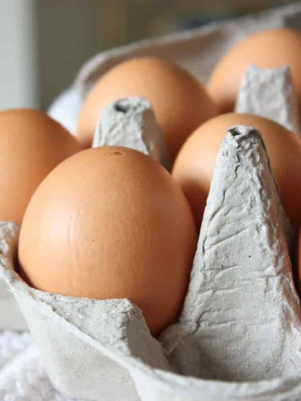 A close up shot of eggs in a carton.