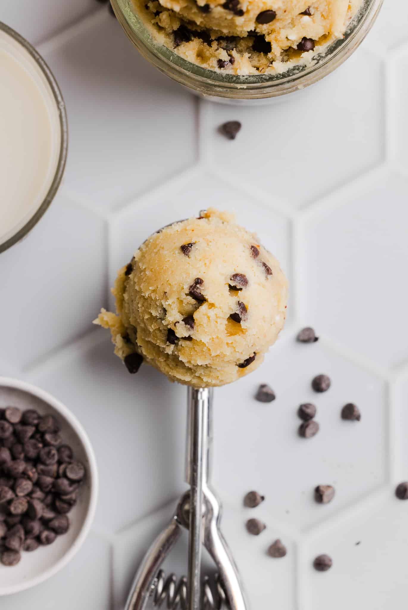 A scoop of cottage cheese cookie dough on a countertop.
