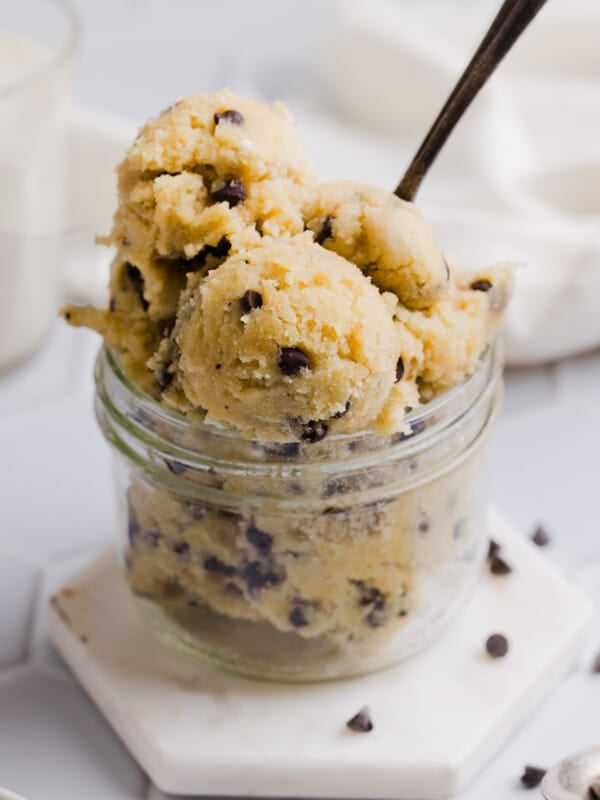 Cottage cheese cookie dough scooped into a mason jar with a spoon.
