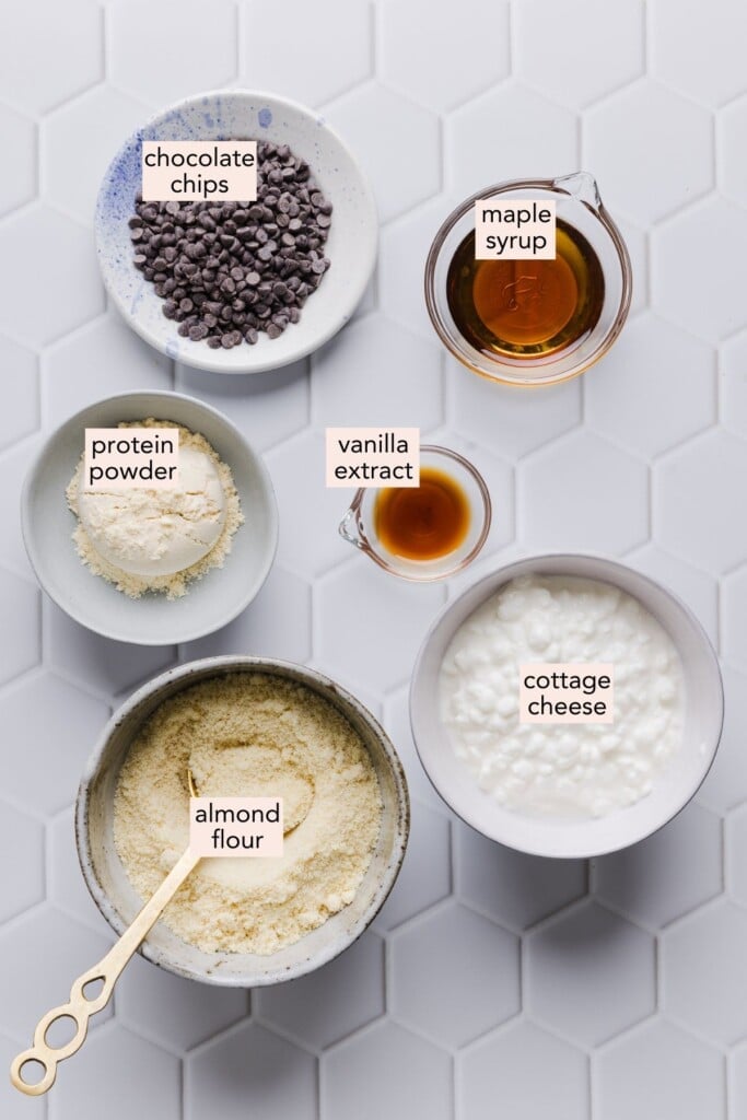 Cottage cheese cookie dough ingredients on a countertop with labels.