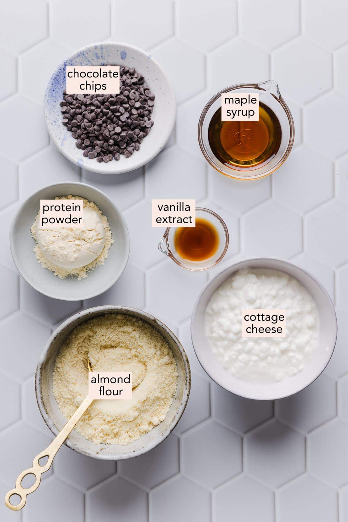Cottage cheese cookie dough ingredients on a countertop with labels.