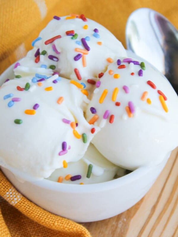 A small white bowl of ninja creami frozen yogurt with colored sprinkles.