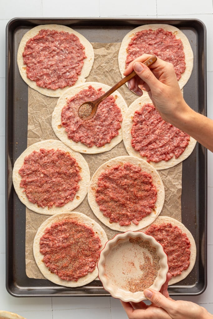 Ground beef and tortillas being seasoned.