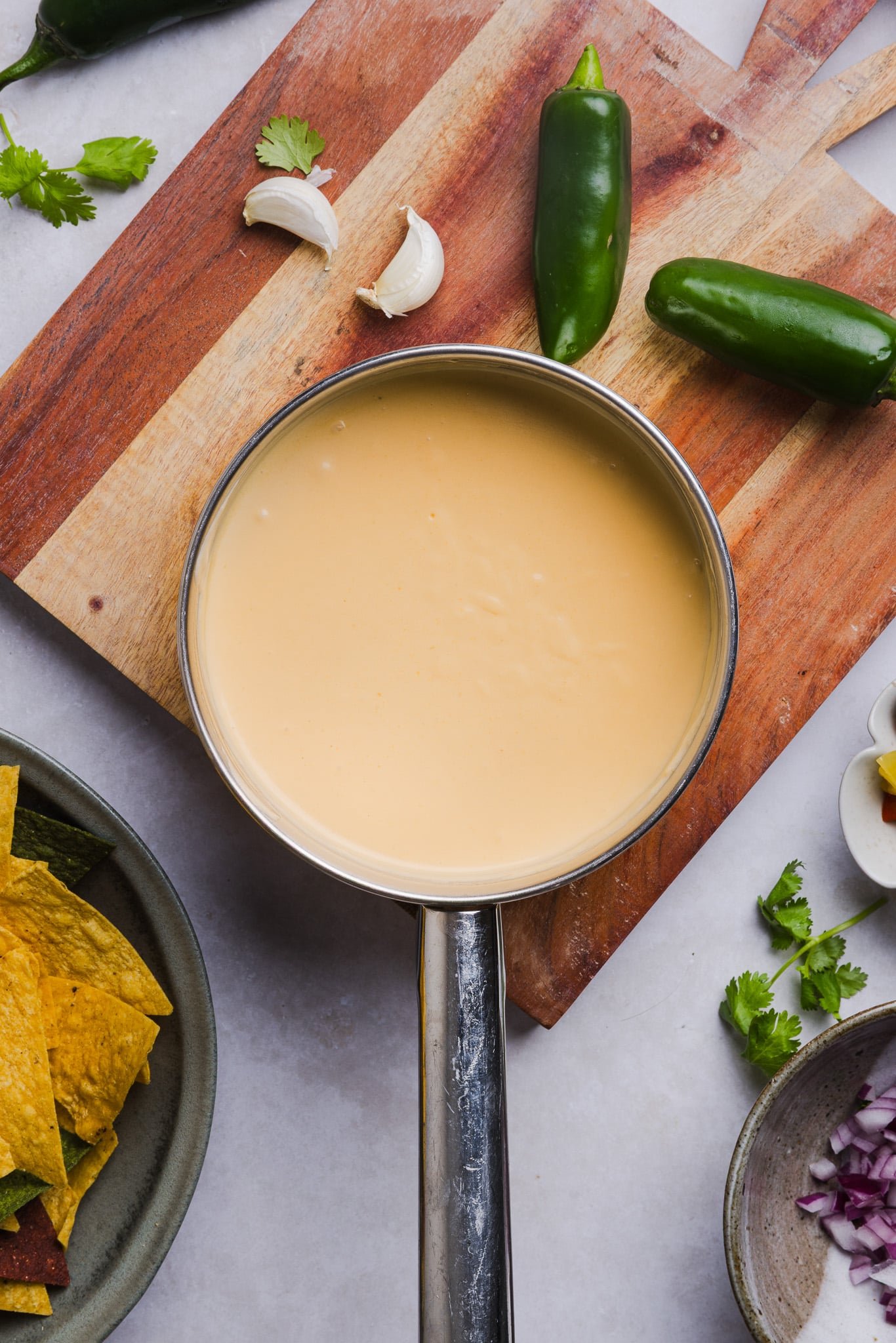 Cottage cheese queso being heated up in a pan.