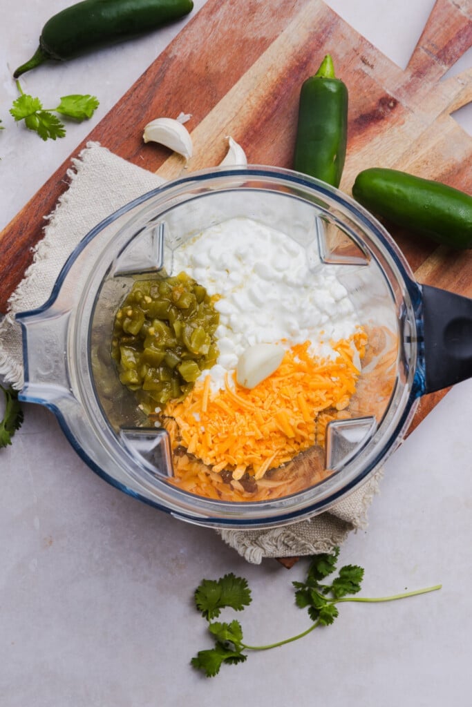 Cottage cheese, shredded cheese, garlic and diced green chiles in a blender.