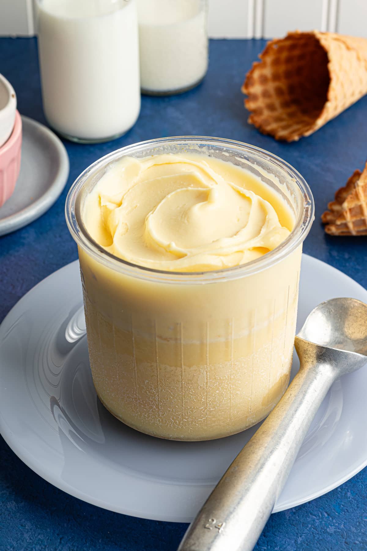 A Ninja Creami pint container full of vanilla protein ice cream.