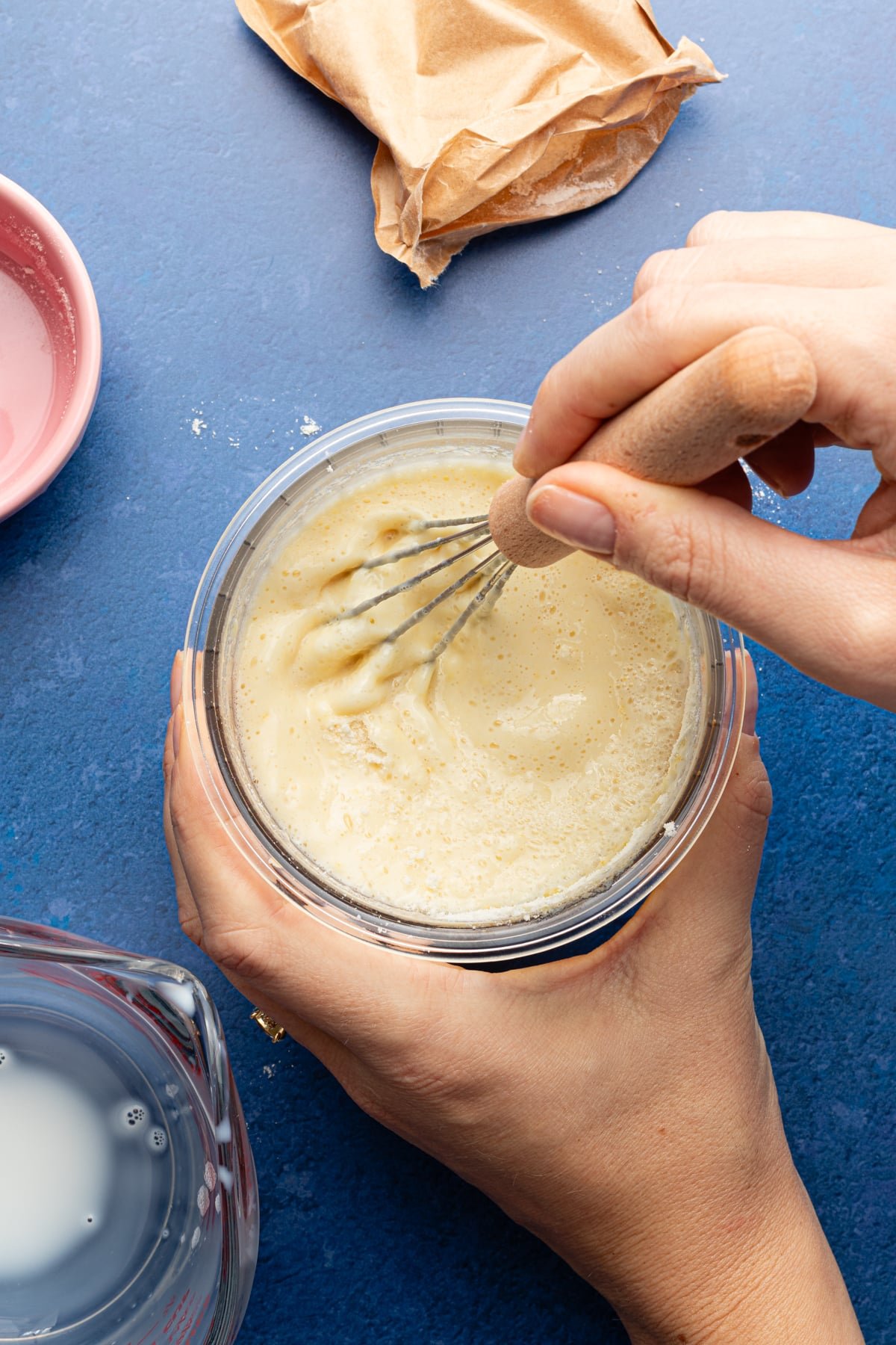 Ninja Creami protein ice cream ingredients being whisked in a pint container.