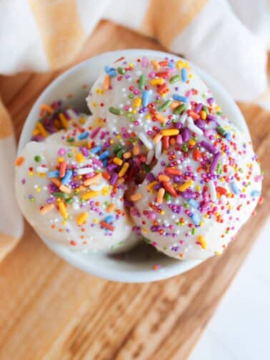 Overhead shot of Ninja Creami protein ice cream with colorful sprinkles.