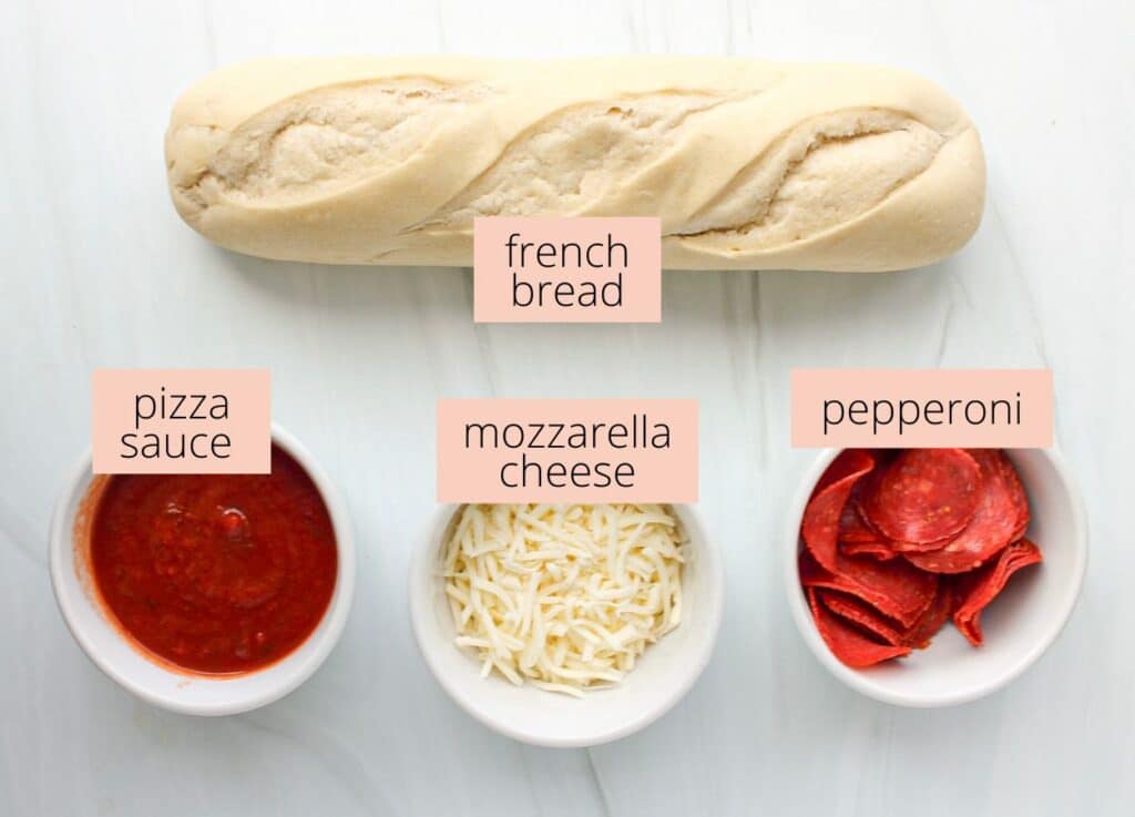Pizza boat ingredients on a white countertop with labels.