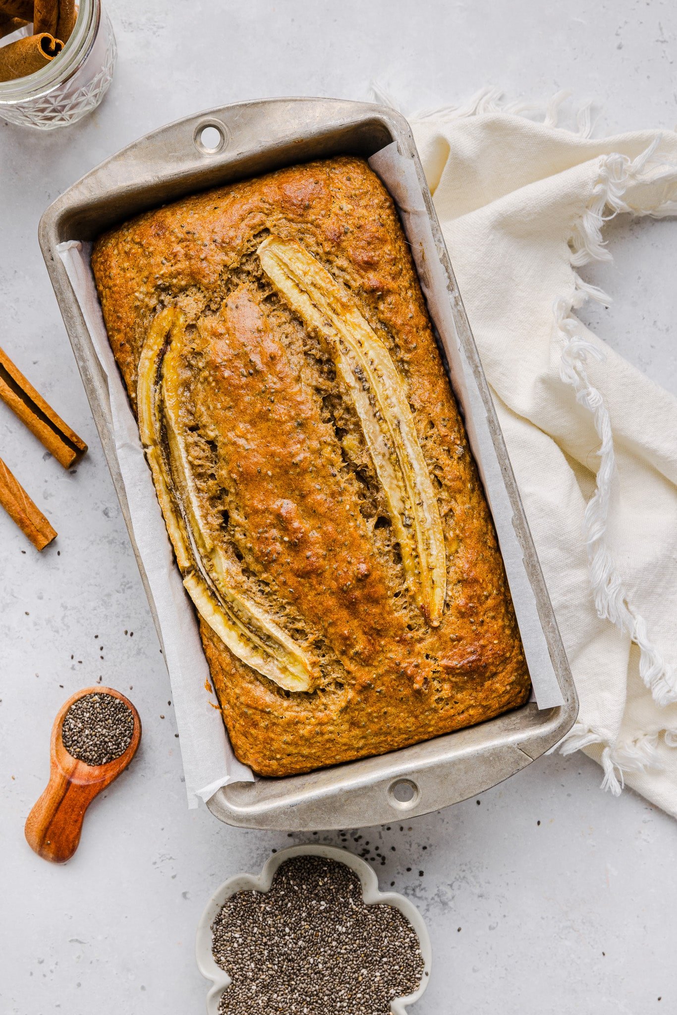 Banana chia bread baked in a loaf pan.
