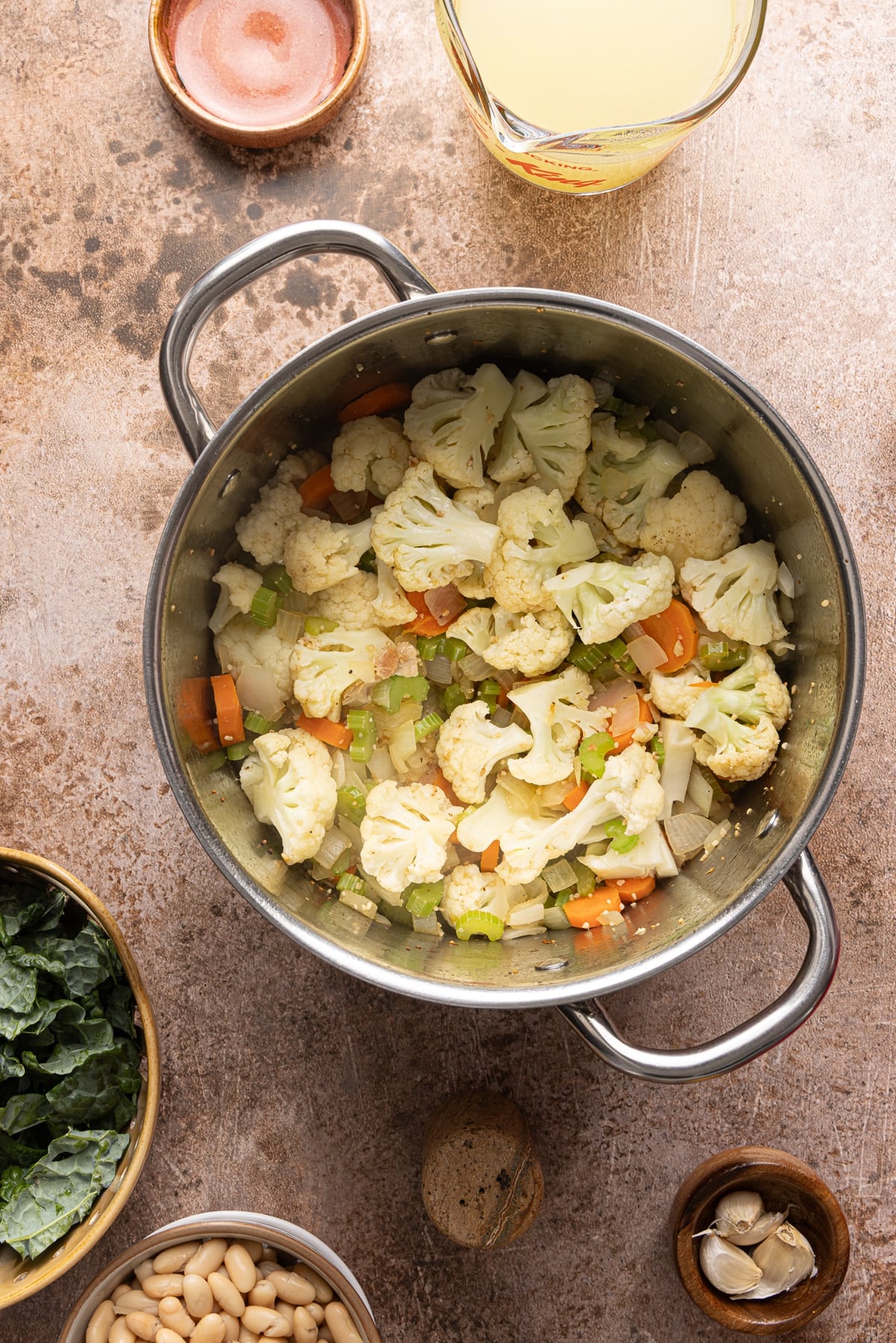 The veggies in the pot after cooking until they begin to soften.