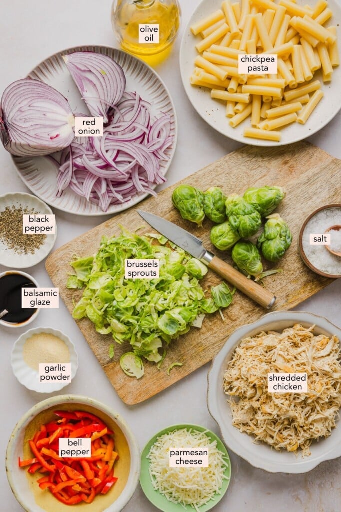 Ingredients for brussels sprouts pasta bowl on a countertop with labels.