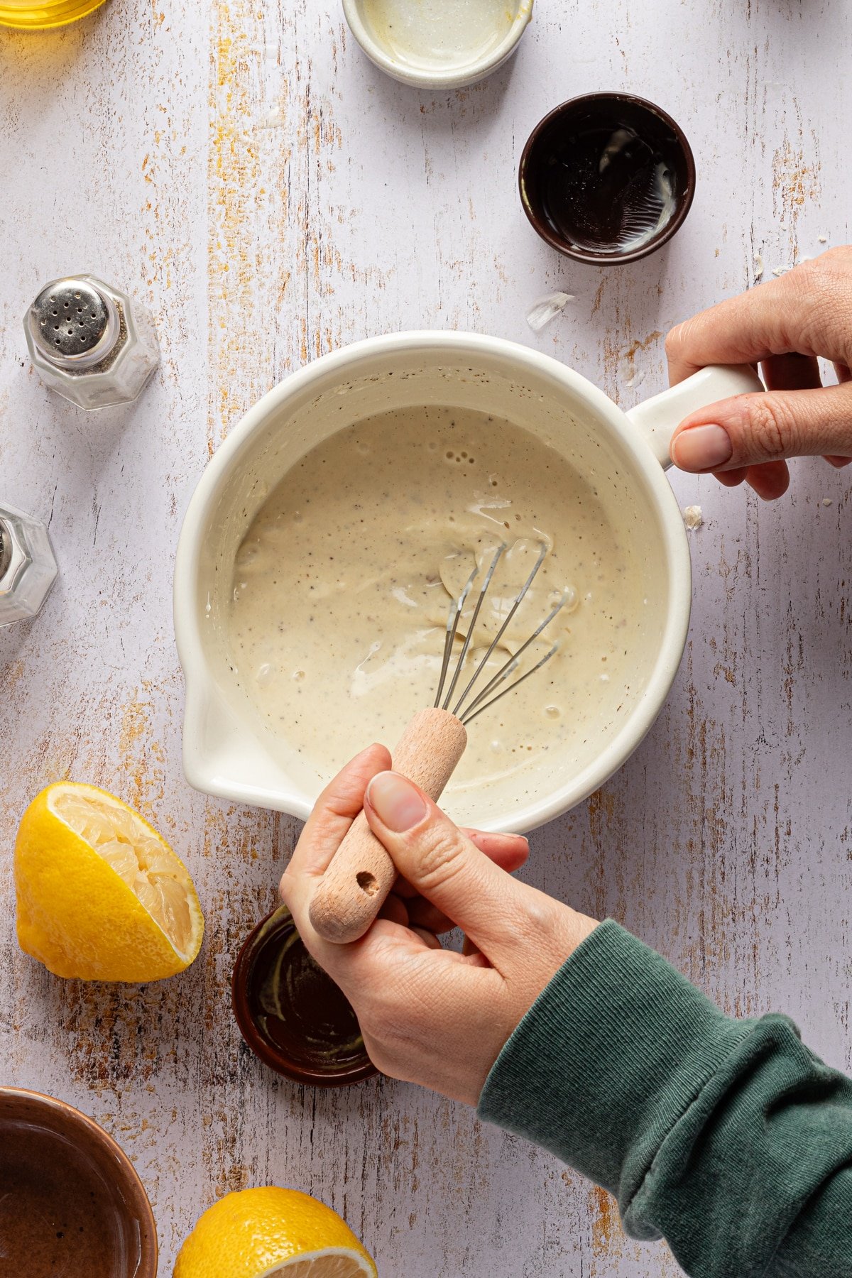 Creamy dressing for kale chicken salad being mixed in a bowl.