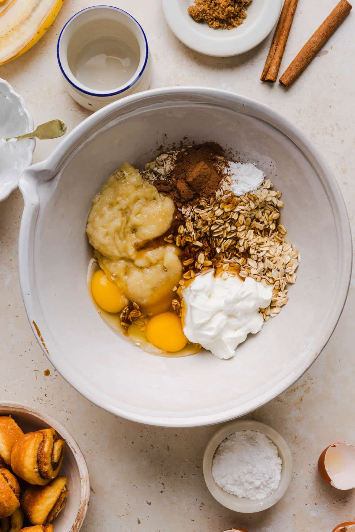 All of the ingredients for the cinnamon roll baked oatmeal in the bowl before mixing.