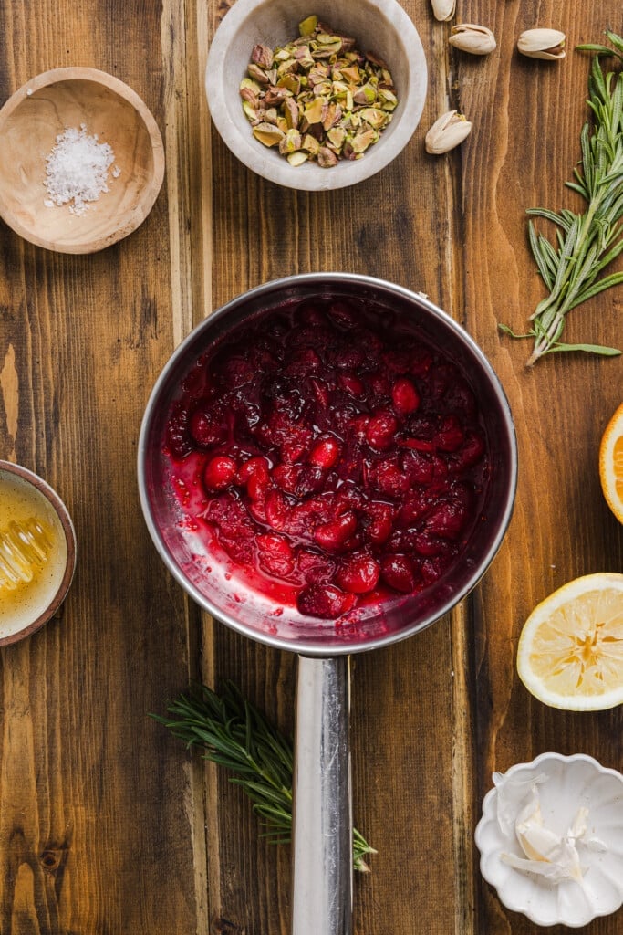 Cranberry sauce cooked in a small pan.