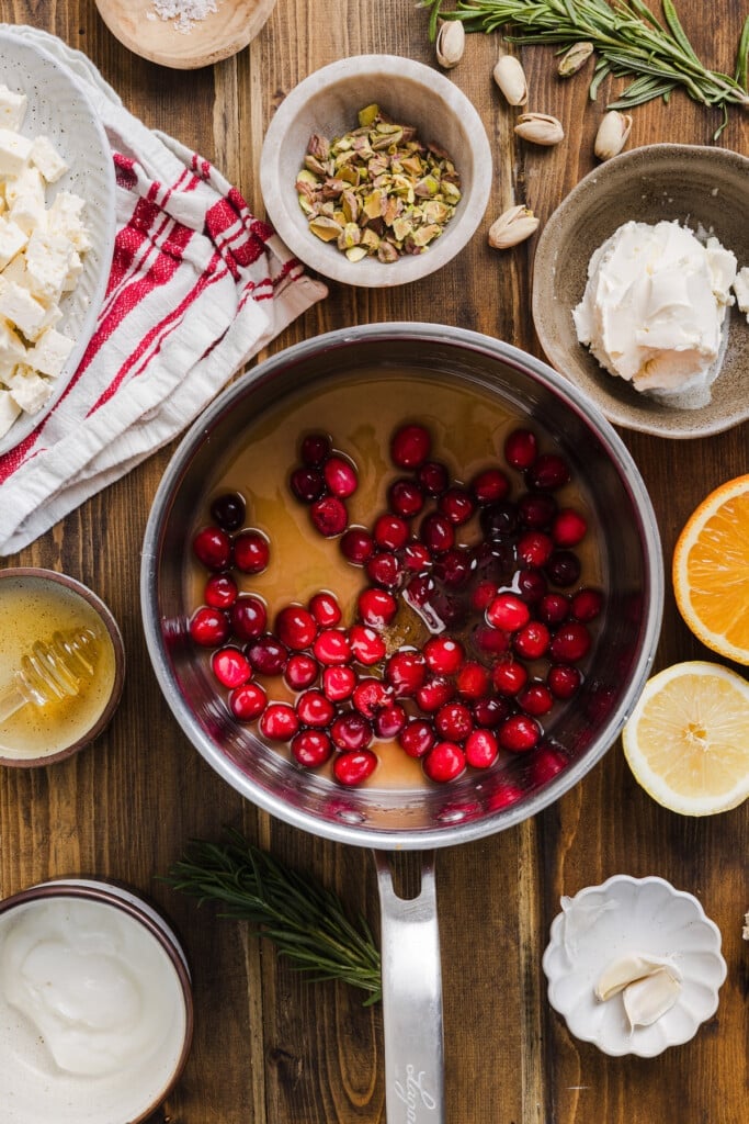 Cranberries honey and orange juice in a small pan. 