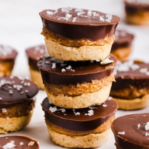 Three Twix bites stacked on a countertop.