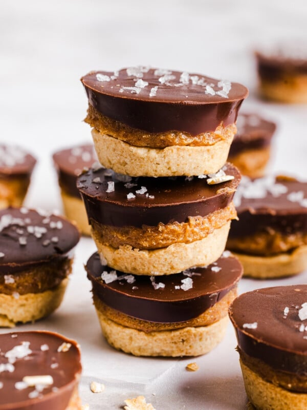 Three Twix bites stacked on a countertop.