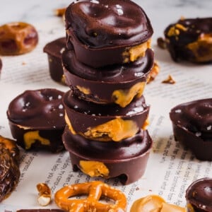 Four stacked peanut butter pretzel date bites.