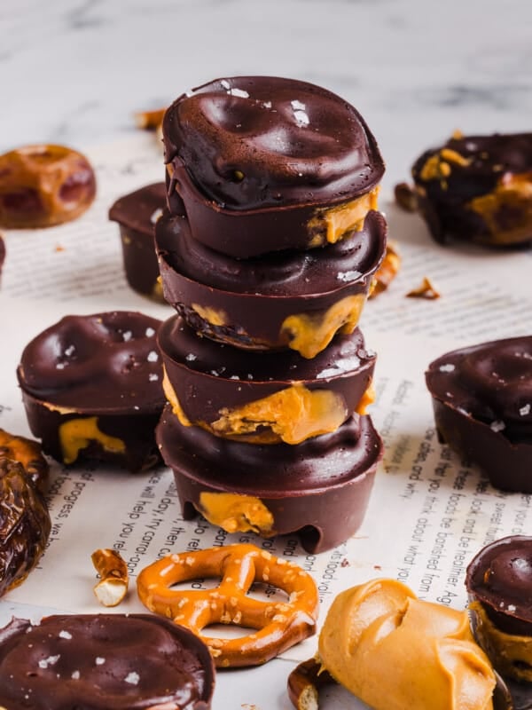 Four stacked peanut butter pretzel date bites.