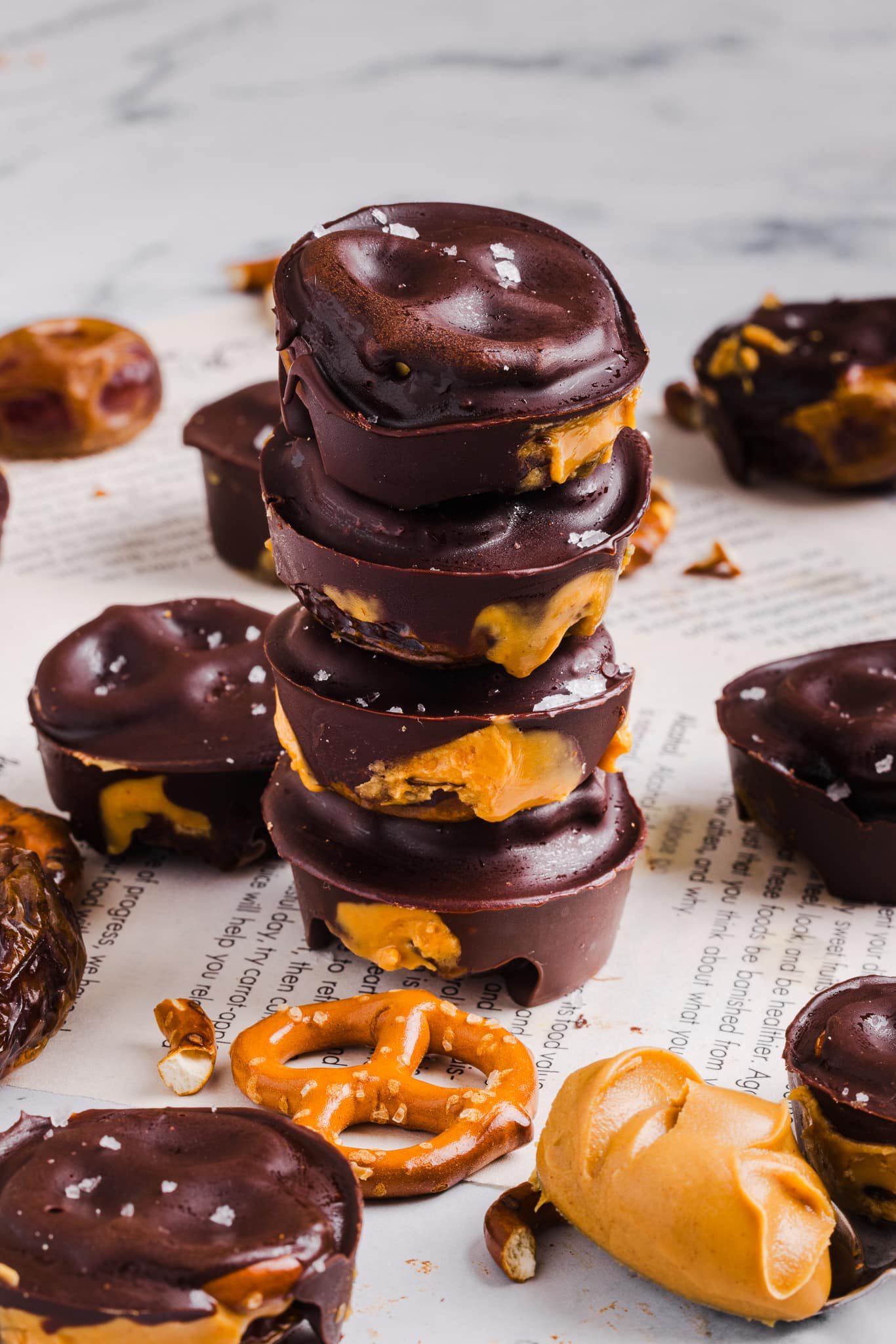 Four stacked peanut butter pretzel date bites.