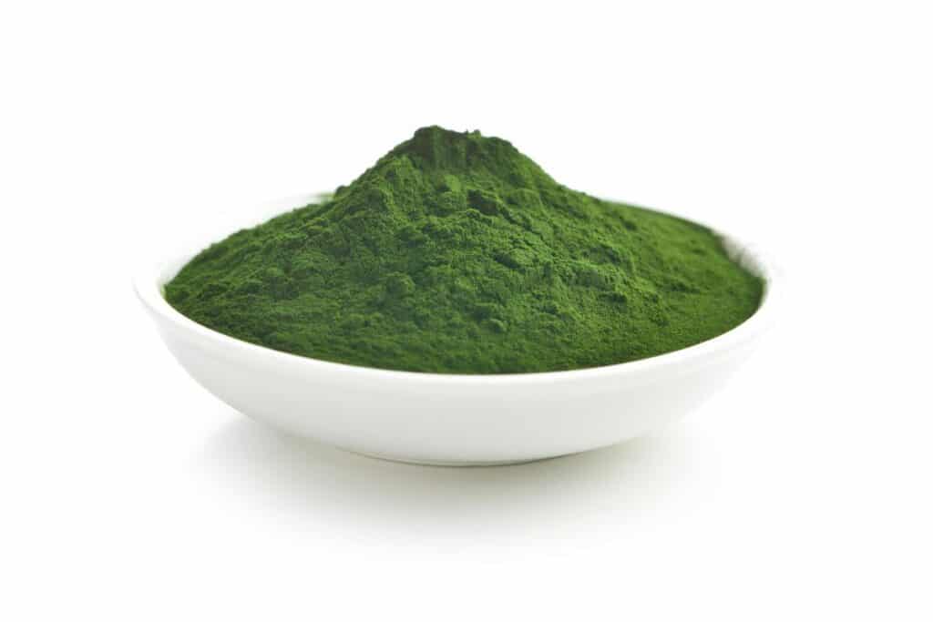 A small white bowl of greens powder.