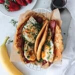 Breakfast pancake tacos with whole wheat pancakes, bacon and fried eggs.