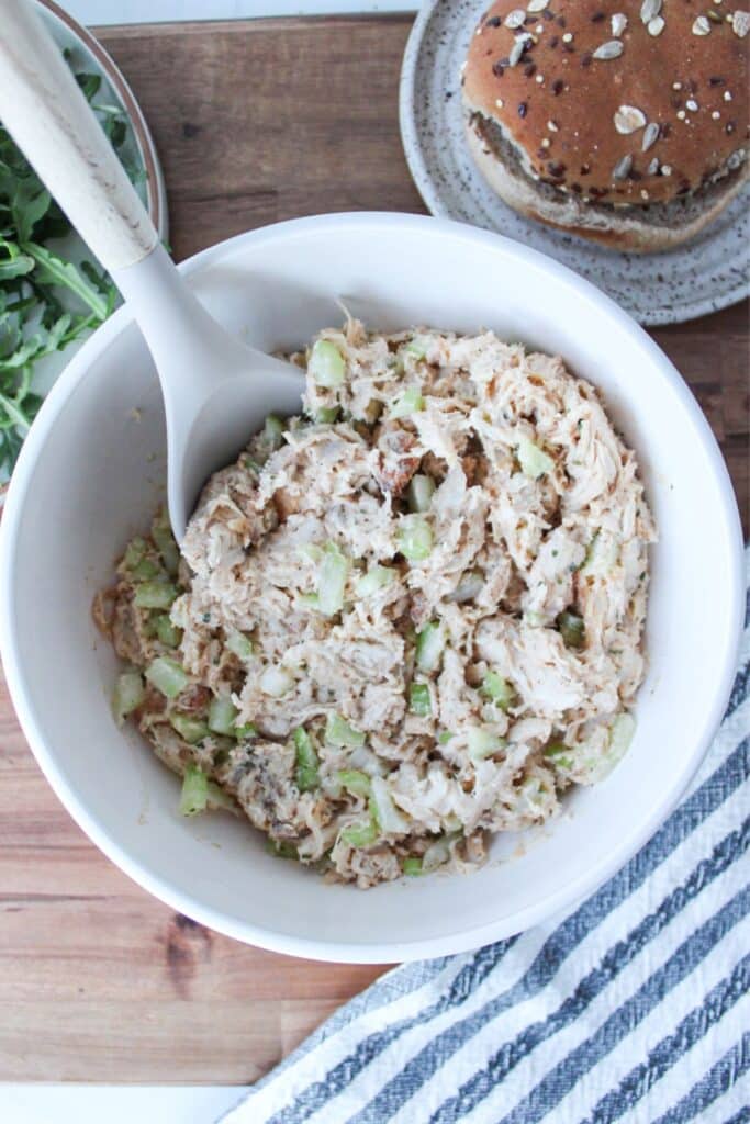 An overhead shot of 4-ingredient chicken salad in a cream bowl.