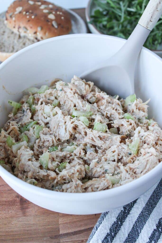 A close up shot of 4-ingredient chicken salad in a cream bowl.