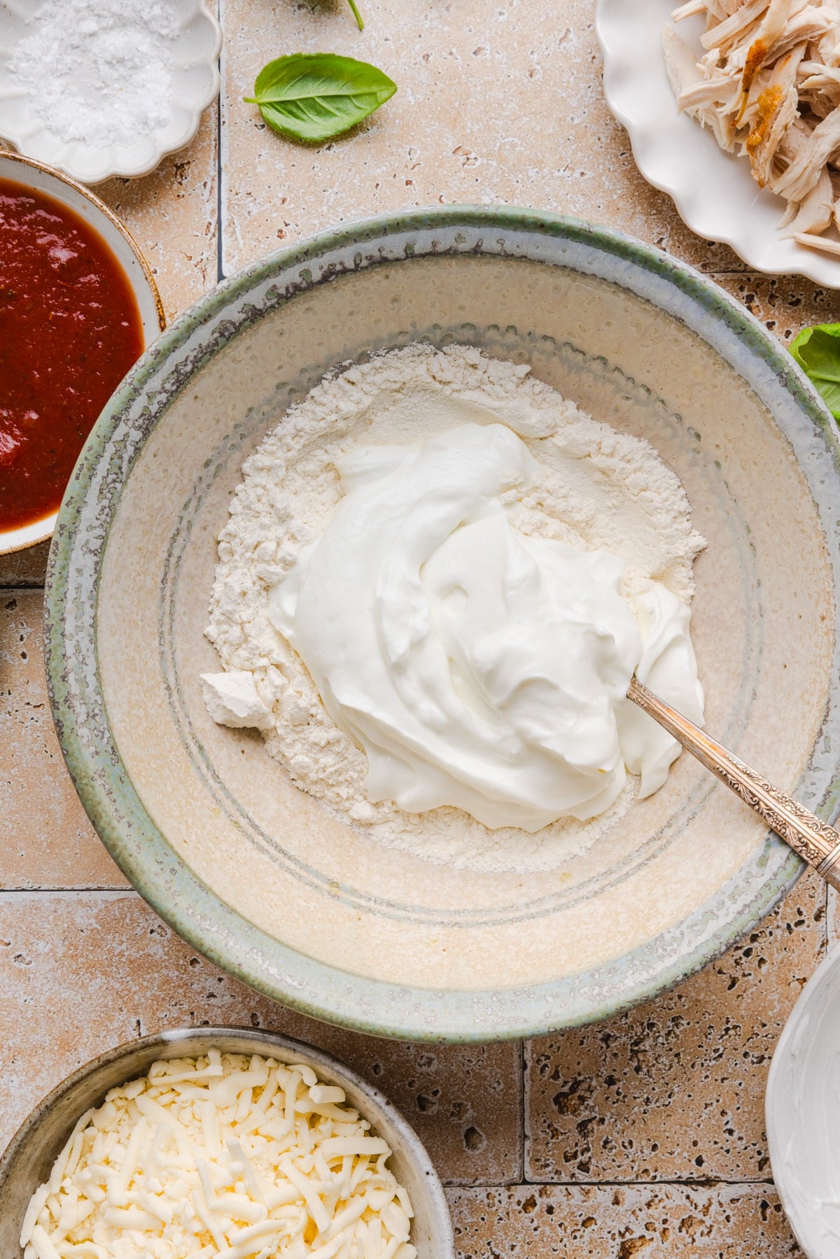 The pizza crust ingredients in a bowl before mixing everything together.