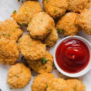 Homemade chicken nuggets made with ground chicken with ketchup.