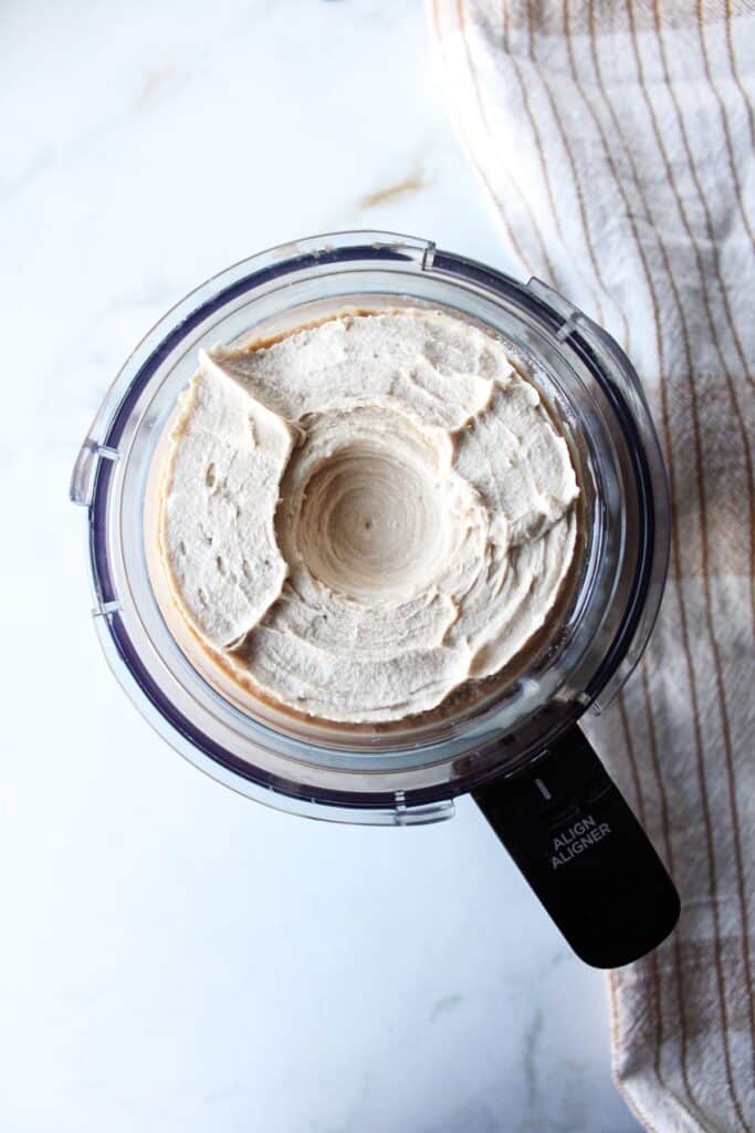 Ninja creami coffee ice cream in the container after three spins.