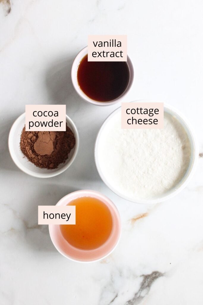 Cottage cheese chocolate mousse ingredients on a countertop with labels.