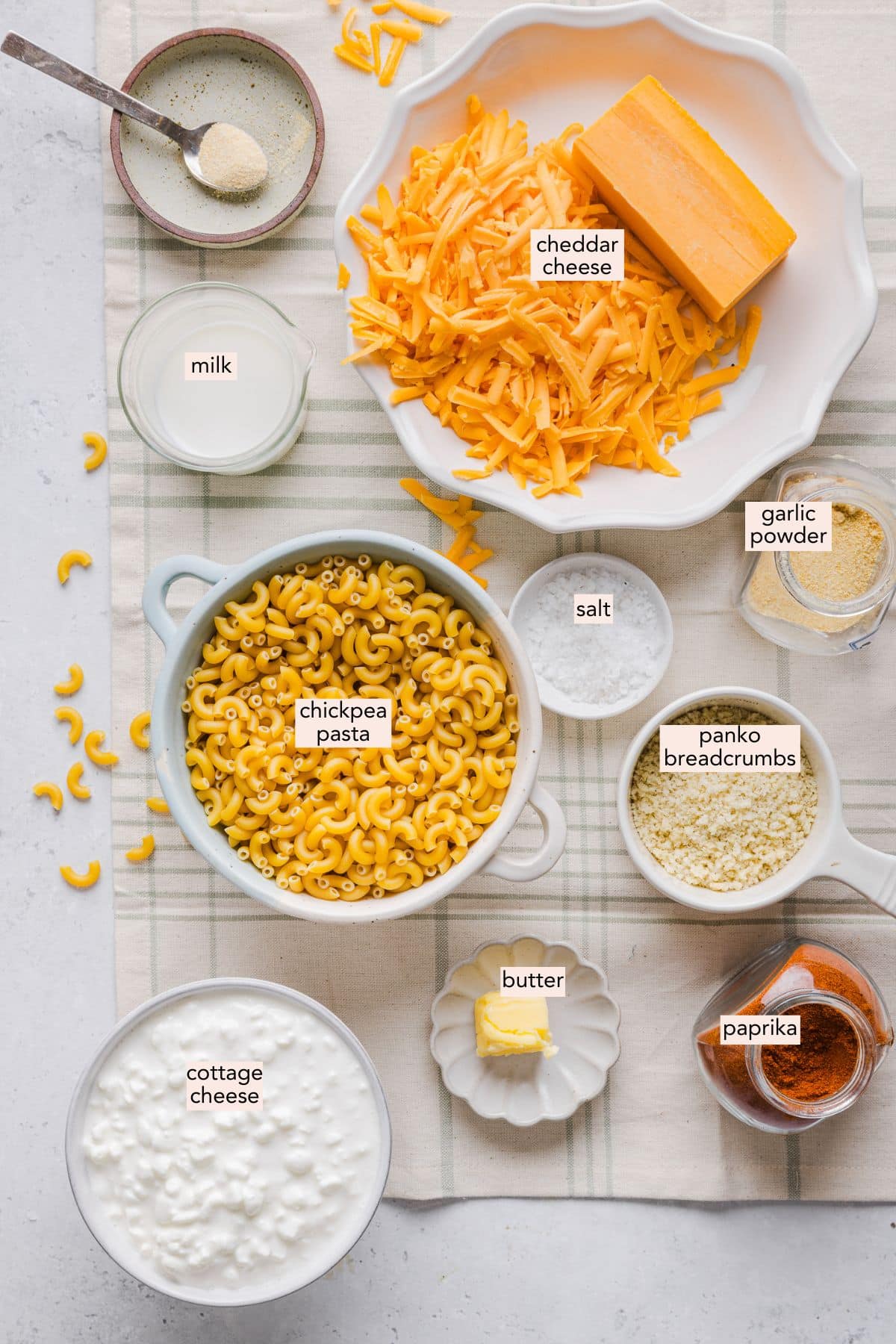 Ingredients for high protein macaroni and cheese on a countertop with labels.
