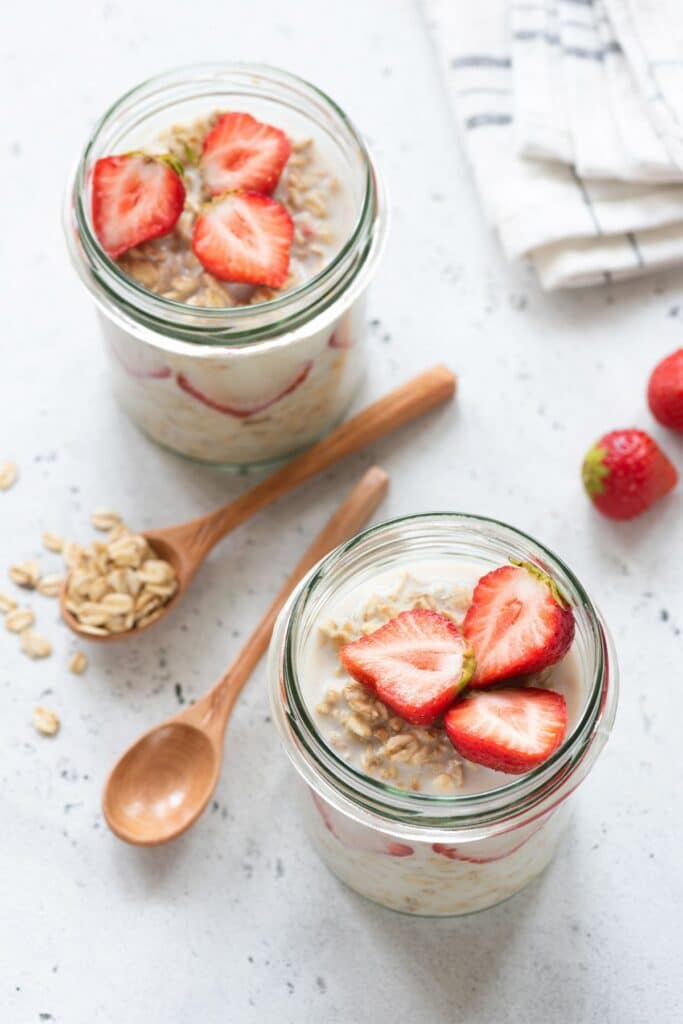 Two jars of strawberry overnight oats.