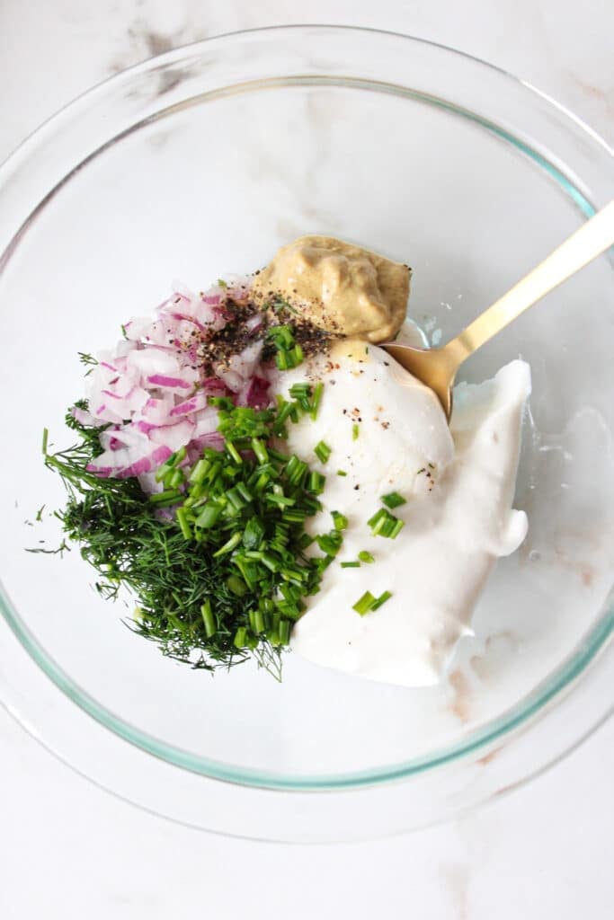 Ingredients for cottage cheese egg salad dressing in a bowl.