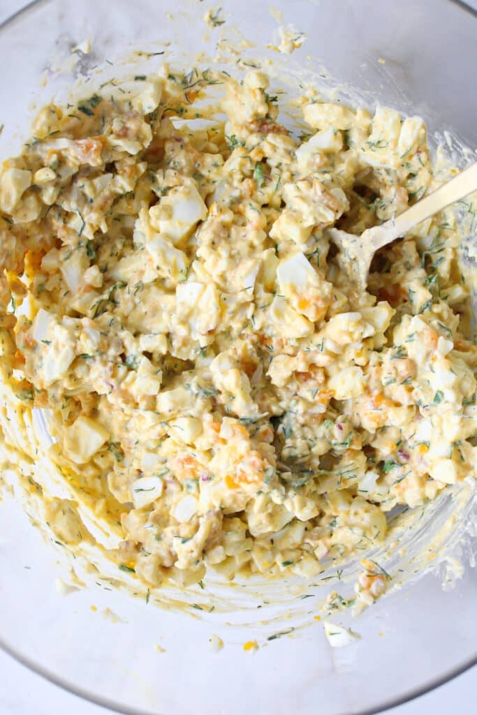 Cottage cheese egg salad in a bowl with a spoon.