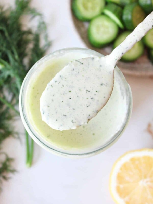 A close up overhead shot of cucumber ranch dressing.