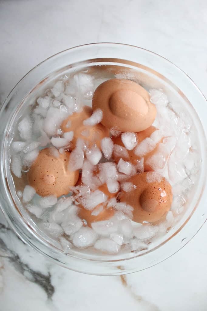 Hard boiled eggs in an ice bath.