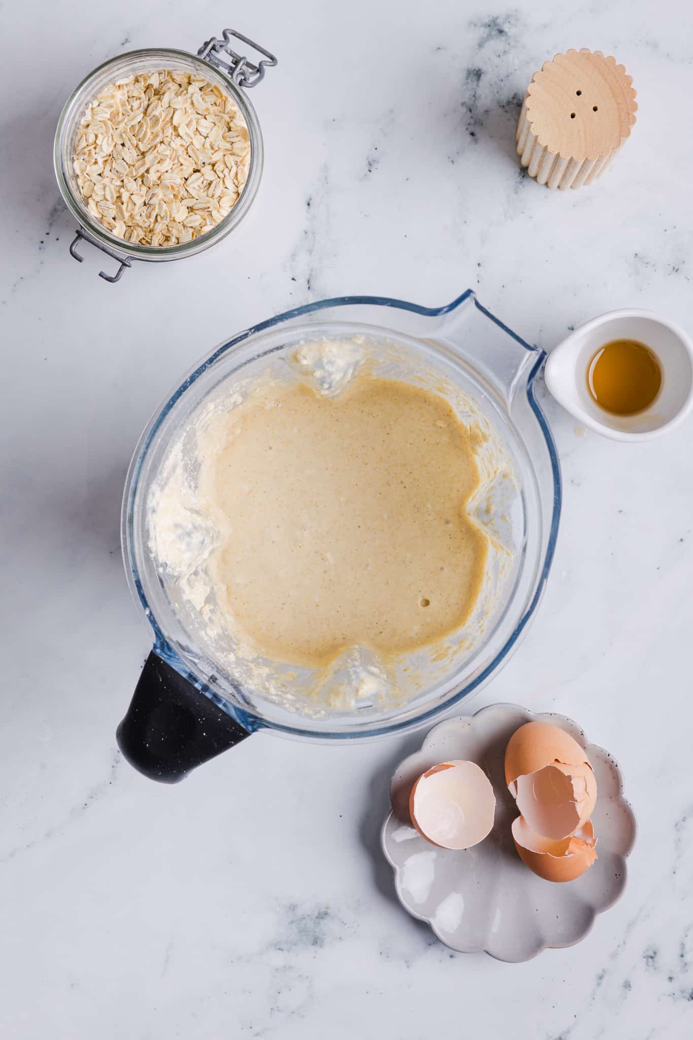 All ingredients for oatmeal cottage cheese pancakes blended in a blender.