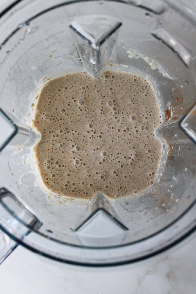 Ingredients for oatmeal cottage cheese pancakes blended in a blender.